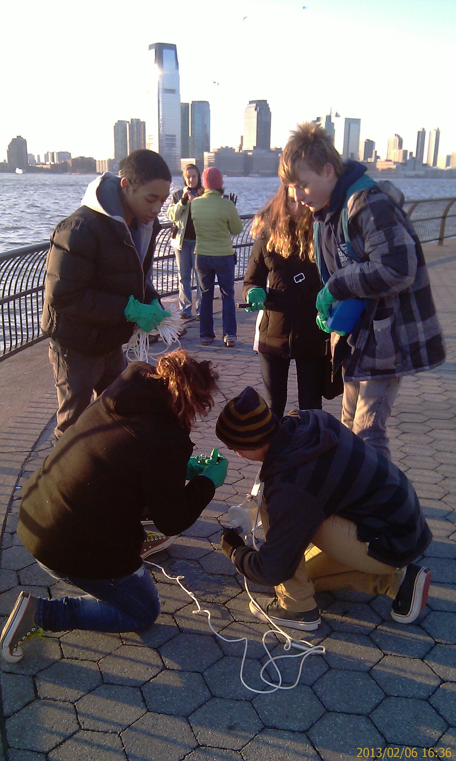 Team M1 of the Harbor SEALs sampling water quality in Manhattan