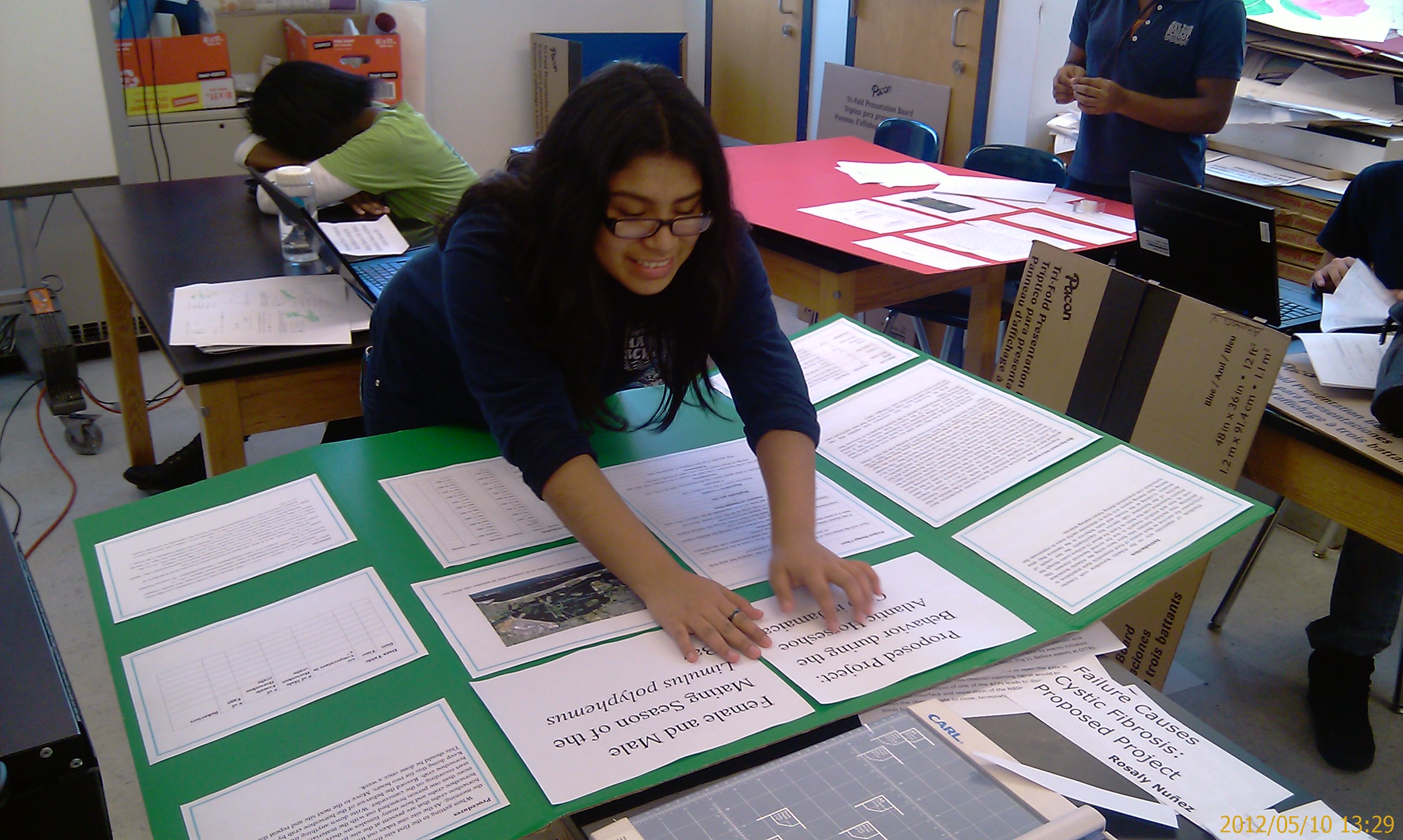 Kimberly MOrales working on her poster display.